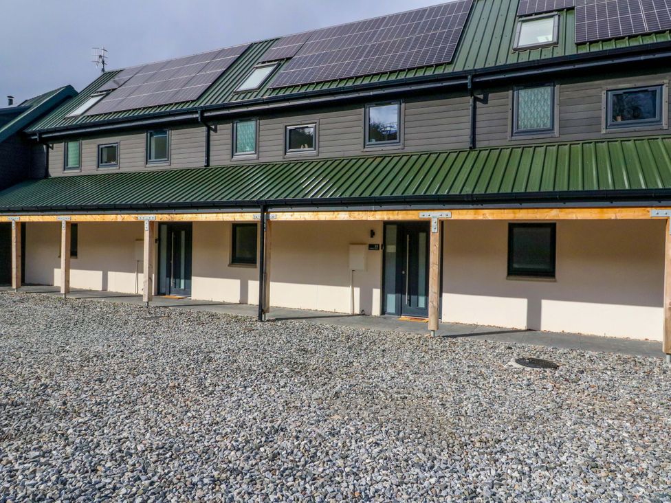An outdoor view of a building with solar panels at 25 Strathtay Lodges Aberfeldy