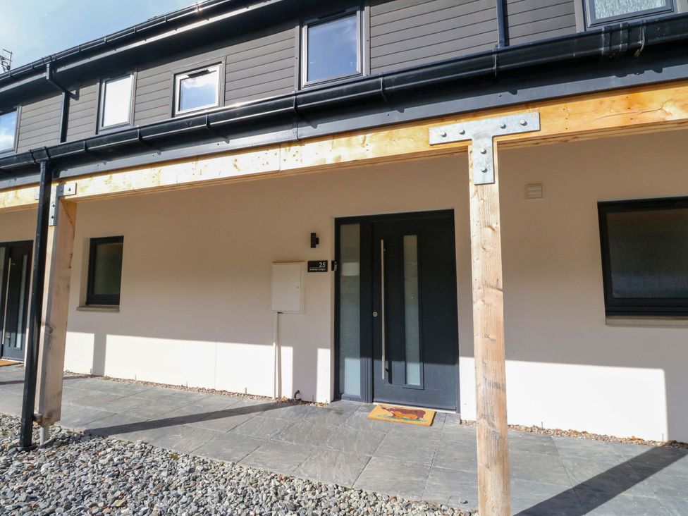 An entrance with a door and windows at 25 Strathtay Lodges in Aberfeldy