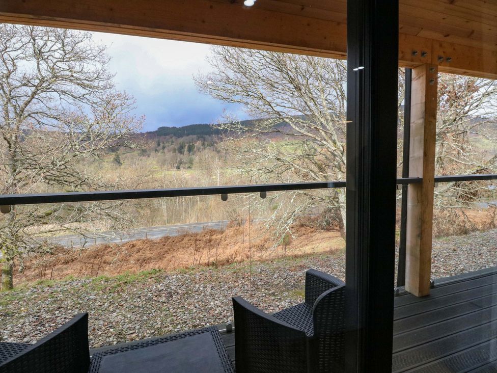 An outdoor viewing area with chairs and a view at 25 Strathtay Lodges Aberfeldy