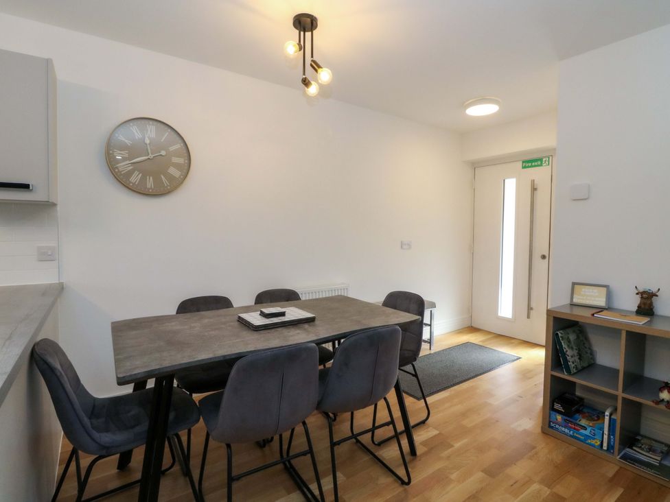 A dining room with a table and chairs at 25 Strathtay Lodges in Aberfeldy