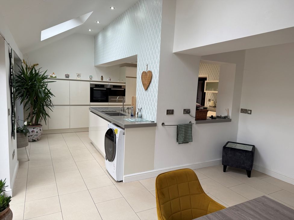 A kitchen with a plant and countertop at Old Mill House in Cuckney