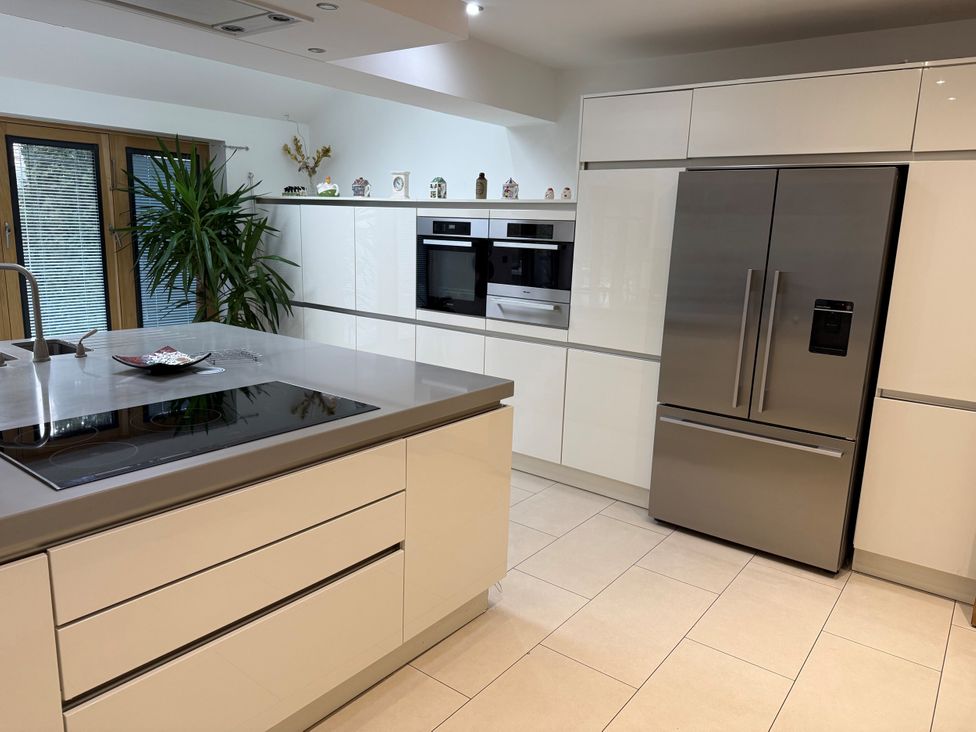 A kitchen with appliances and cabinets at Old Mill House in Cuckney
