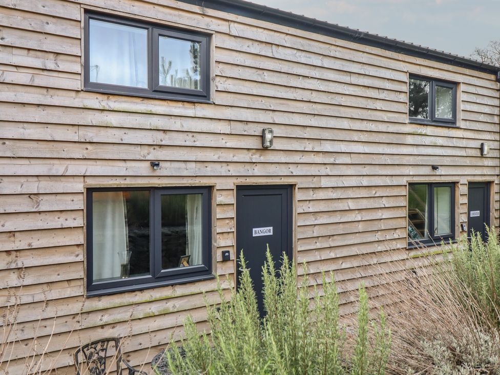 An exterior view of a building with windows and a door at Bangor in Knolton near Ellesmere