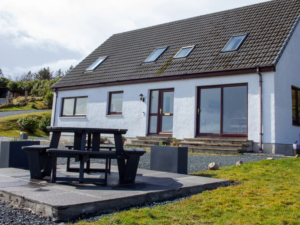 A house with outdoor seating area at Calmdale in Inverasdale near Poolewe