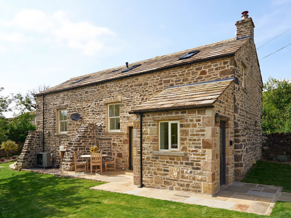 A house with a garden table and chairs at The Reading Rooms Oughtershaw near Buckden