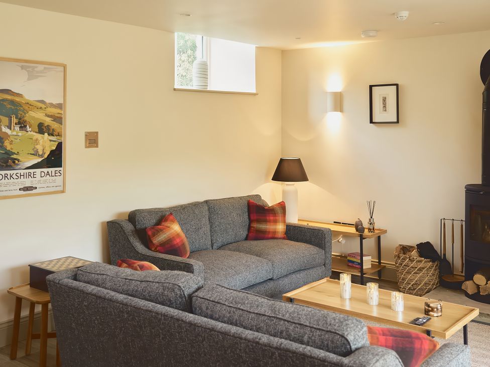 A living room with a sofa and coffee table at The Reading Rooms Oughtershaw near Buckden