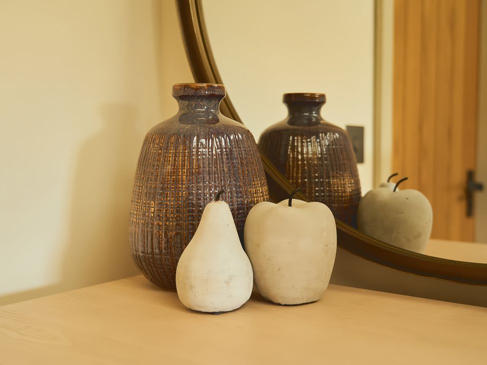 A vase with decorative fruit on a table at The Reading Rooms in Oughtershaw near Buckden