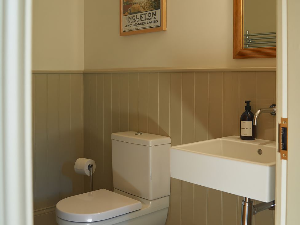 A bathroom with a toilet and hand basin at The Reading Rooms in Oughtershaw near Buckden