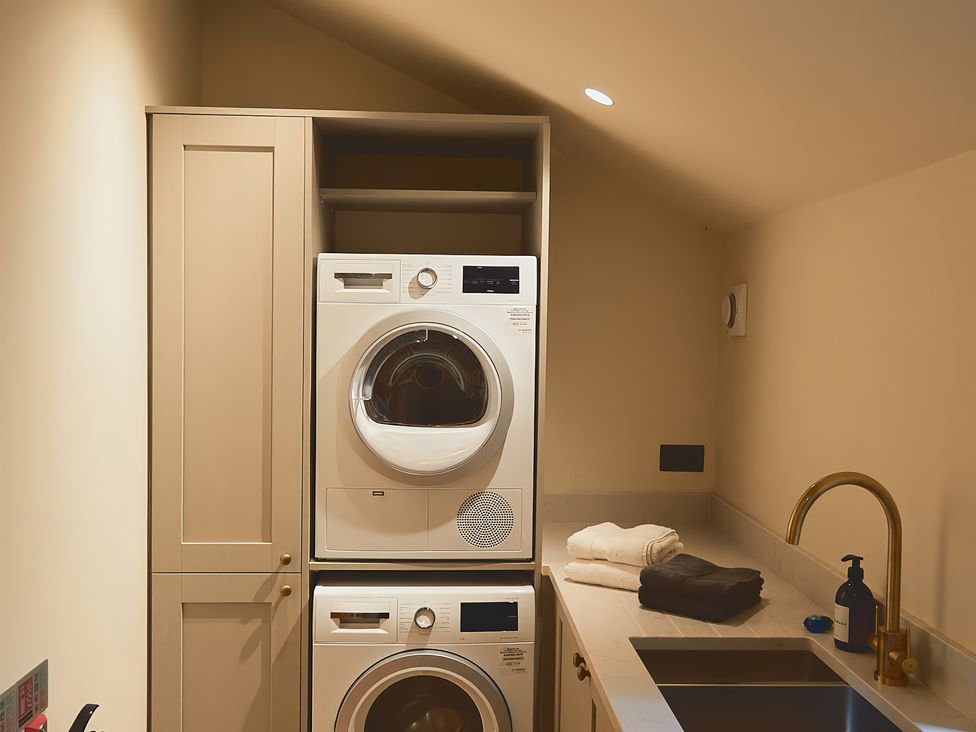 A laundry room with a washing machine and dryer at The Reading Rooms Oughtershaw near Buckden