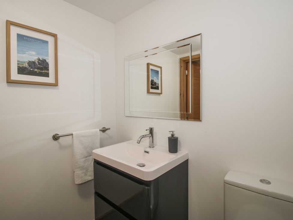 A bathroom with a sink and mirror at The Barn in Acton near Bishop's Castle