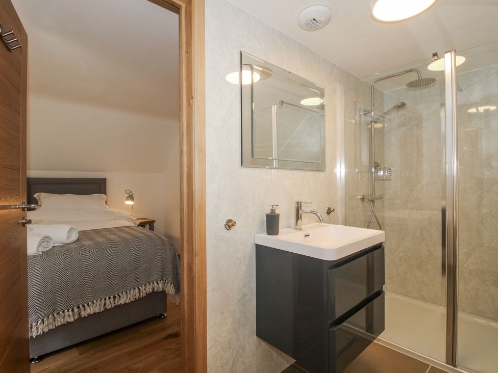 A bathroom with a sink and shower at The Barn in Acton near Bishop's Castle