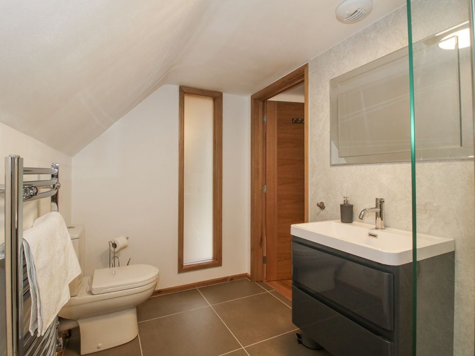 A bathroom with a sink and toilet at The Barn in Acton near Bishop's Castle