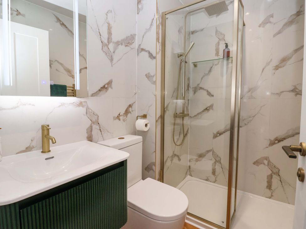 A bathroom with a shower and sink at The Old Bakehouse in 