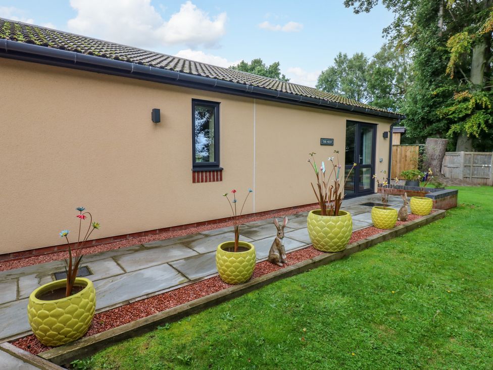 A house with planters and a pathway at The Nest in Wetheral
