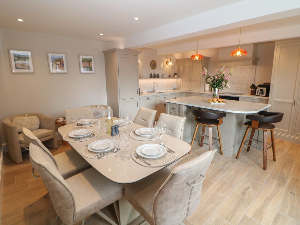 A kitchen with a dining table and chairs at Coach House in Matlock