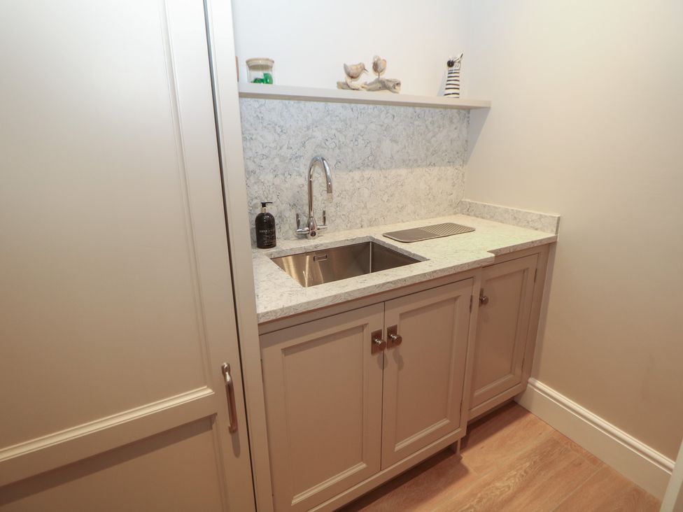 A kitchen with a sink and countertop at Coach House in Matlock