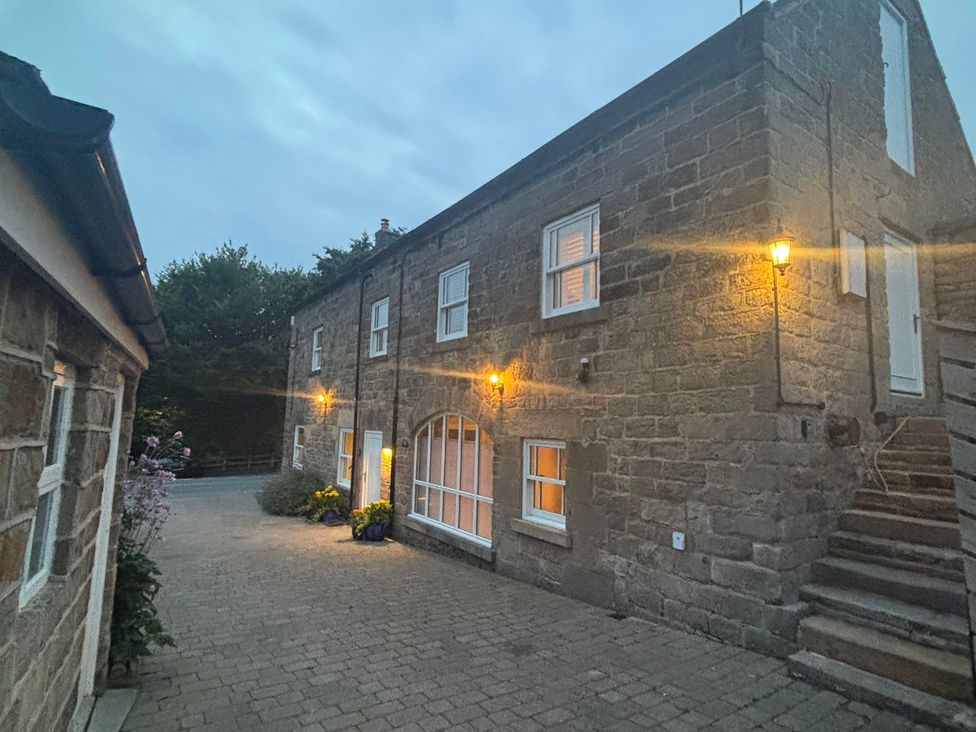 A building with lights and steps at The Coach House in Holloway