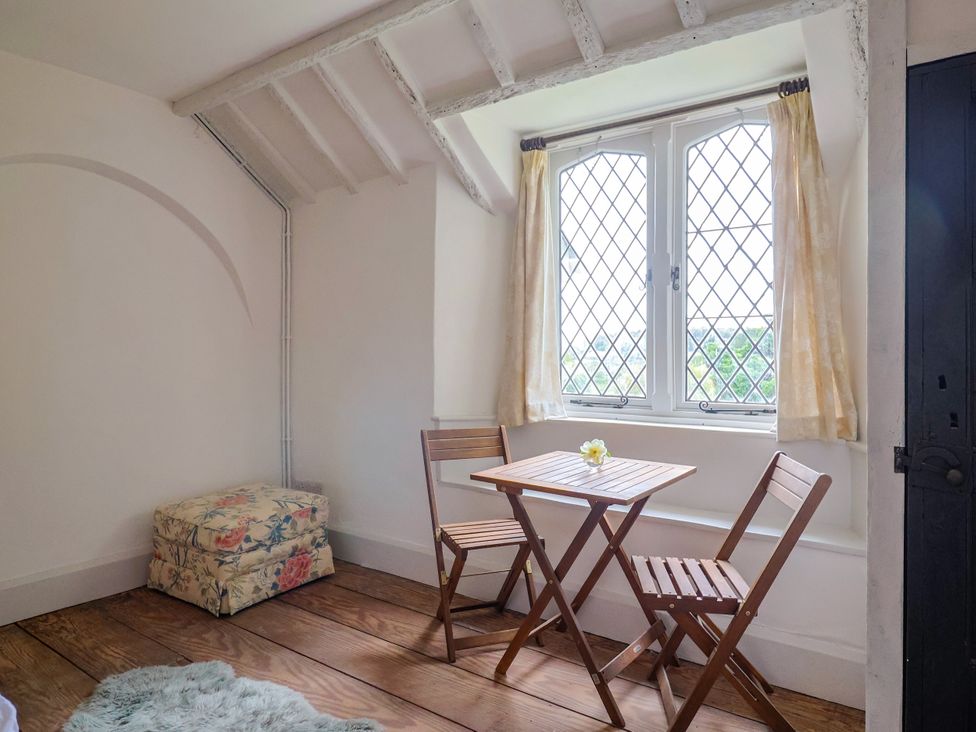 A dinette with a table and chairs at Hole House in Branscombe