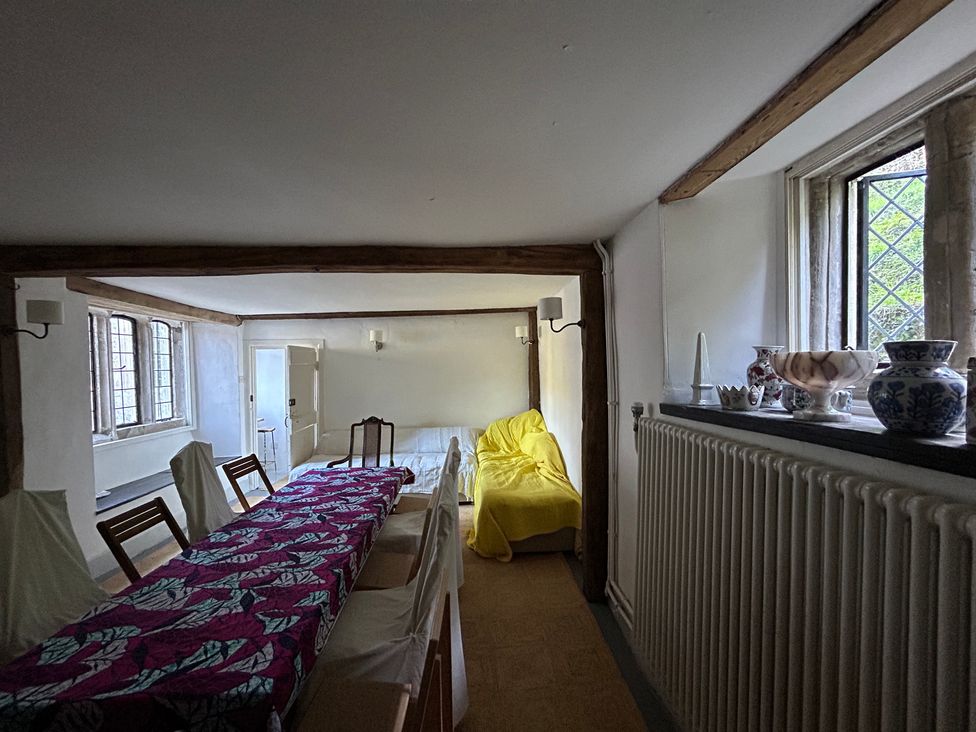 A dining room with a table and chairs at Hole House in Branscombe
