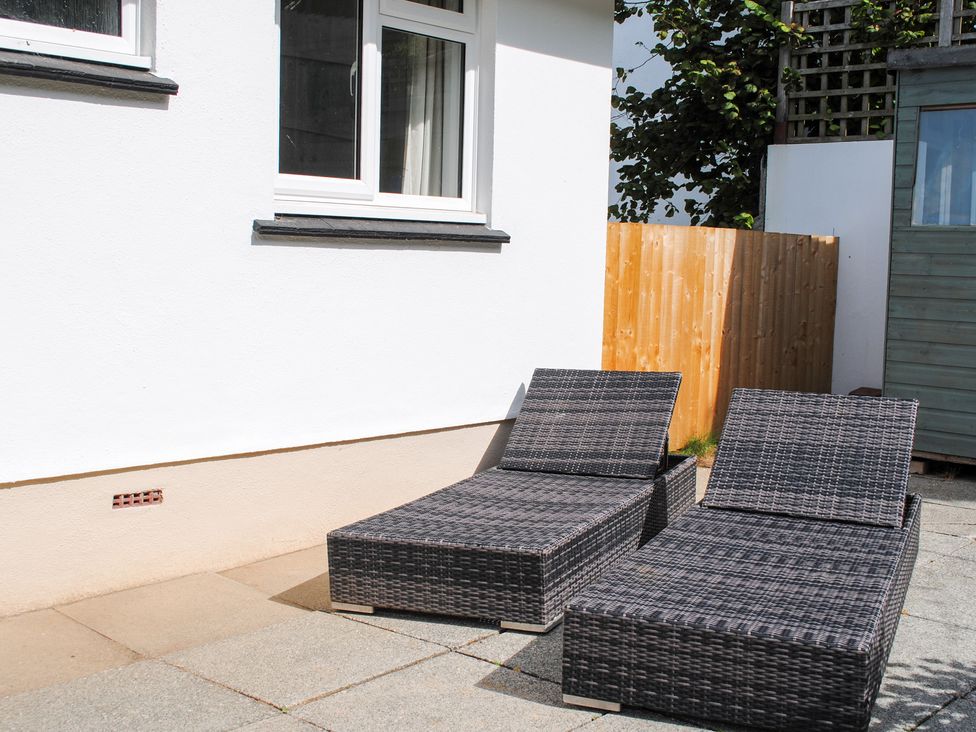 Two lounge chairs in an outdoor area at 15 Beadon Road Salcombe