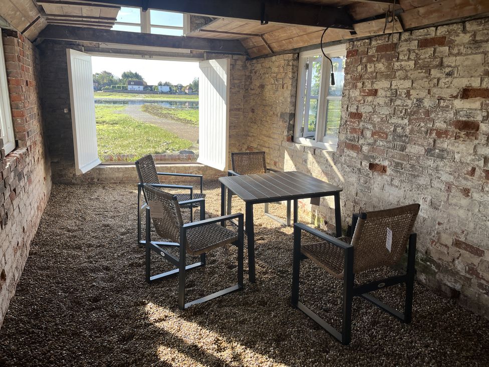 A room with a table and chairs at 8 Mariners Terrace in Chichester