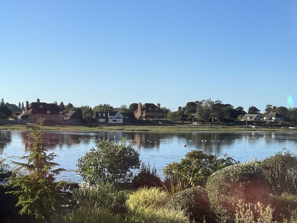 A view of houses by the water at 8 Mariners Terrace in Chichester