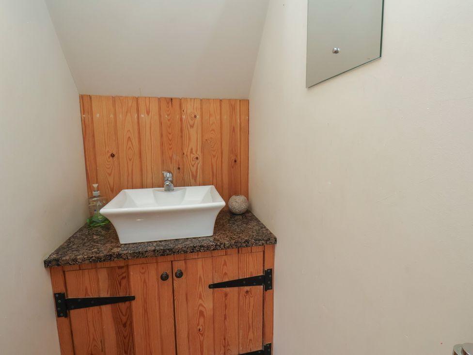 A sink and cabinet in a bathroom at Horseshoe Cottage Ingleby Greenhow near Great Ayton