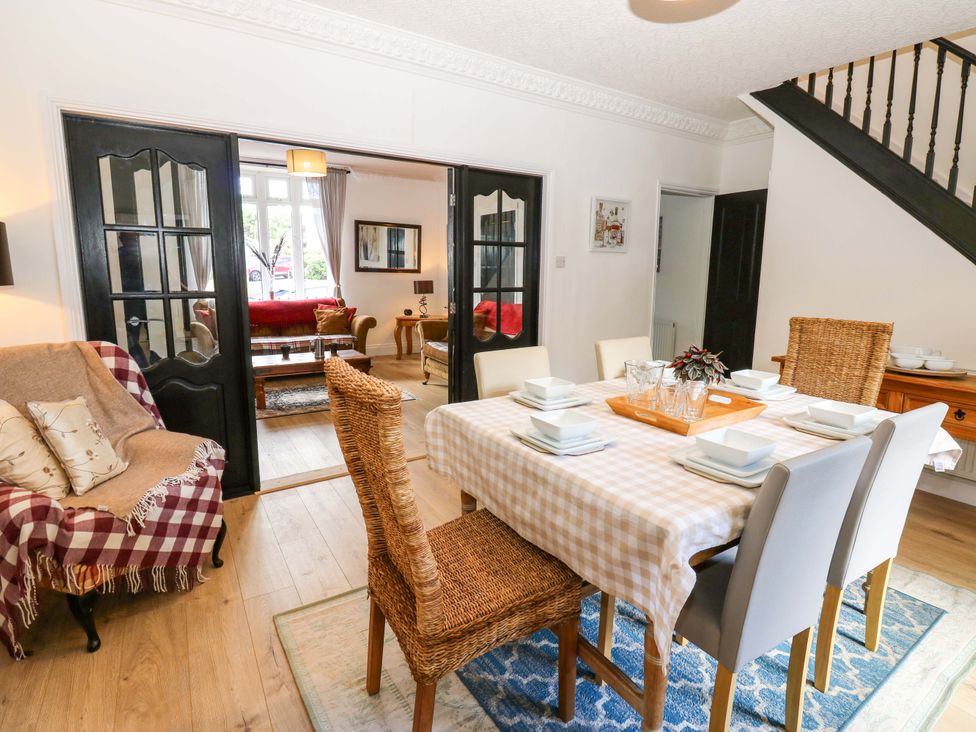 A dining room with a table and chairs at 8 Percy Terrace in Whitburn