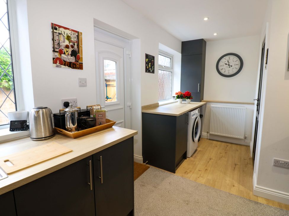 A kitchen with various appliances and decorations at 8 Percy Terrace Whitburn