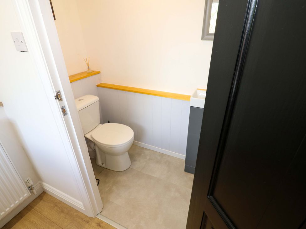A bathroom with a toilet and sink at 8 Percy Terrace Whitburn