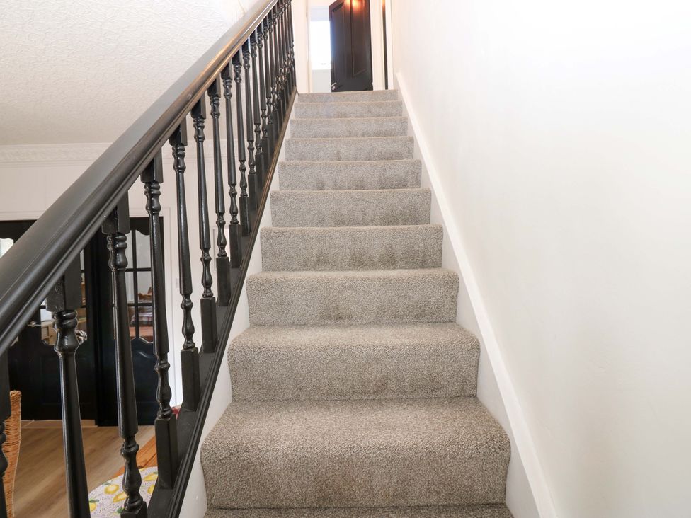 A staircase with carpet and black railing at 8 Percy Terrace Whitburn