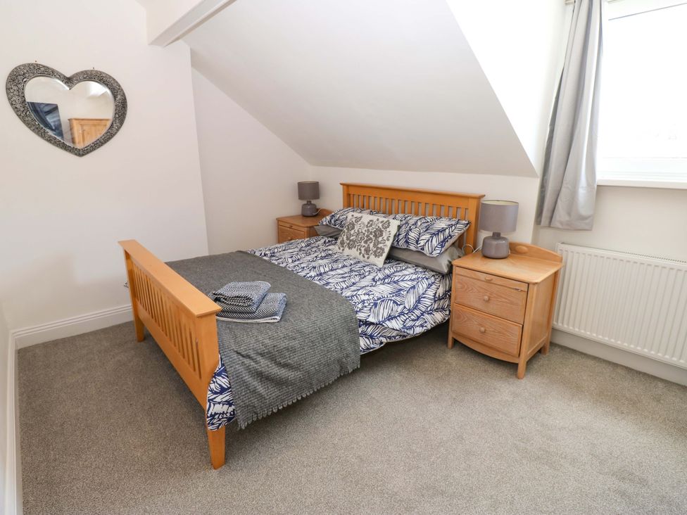 A bedroom with a bed and bedside table at 8 Percy Terrace in Whitburn