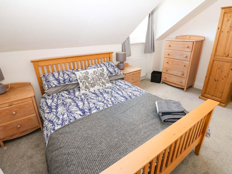 A bedroom with a bed and furniture at 8 Percy Terrace in Whitburn