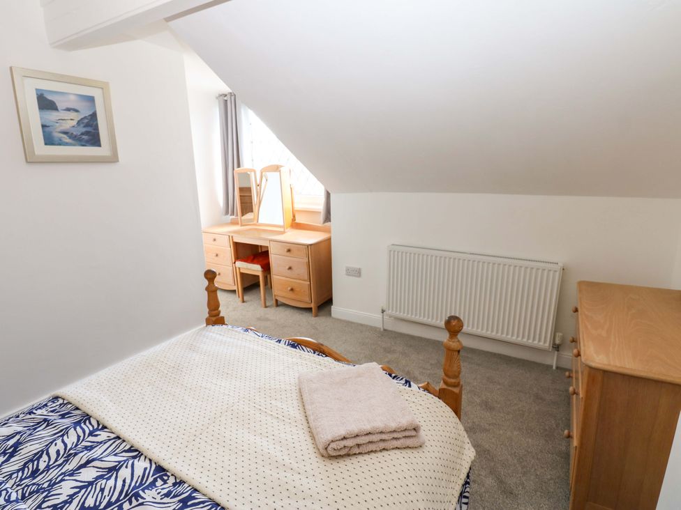 A bedroom with a bed and desk at 8 Percy Terrace in Whitburn
