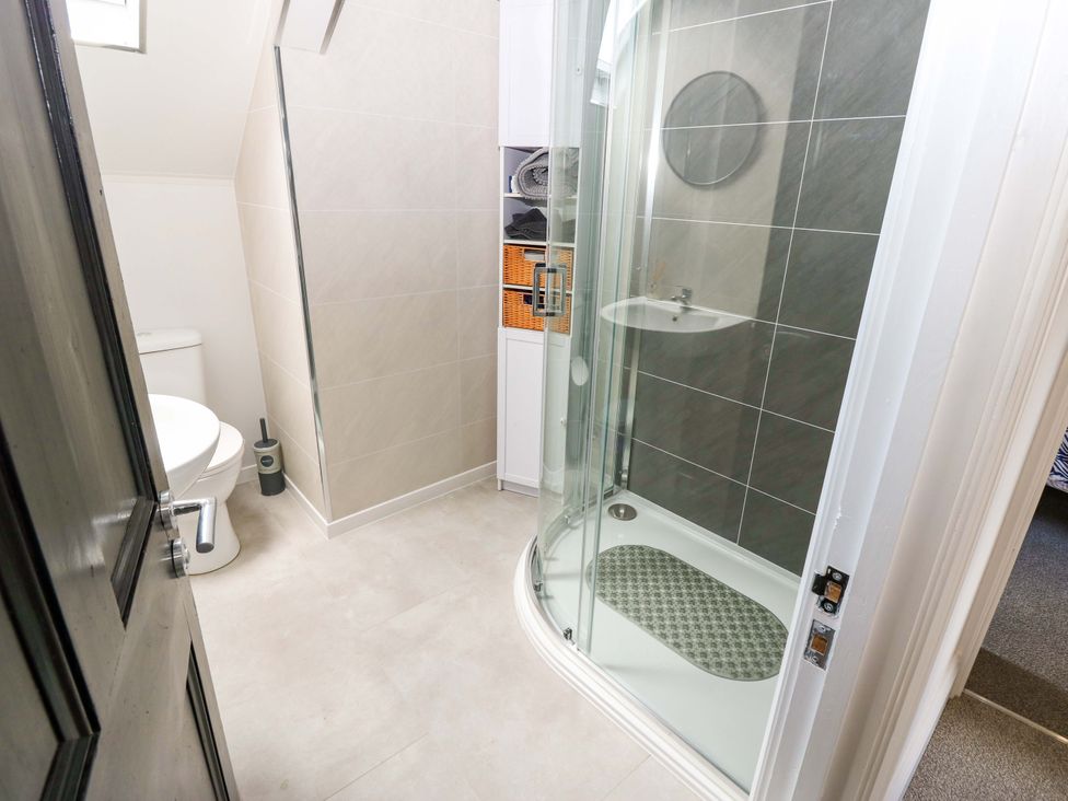 A bathroom with a shower and toilet at 8 Percy Terrace in Whitburn