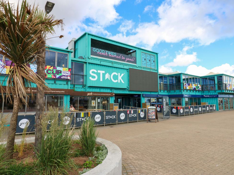 A building with signage and outdoor seating at 8 Percy Terrace in Whitburn