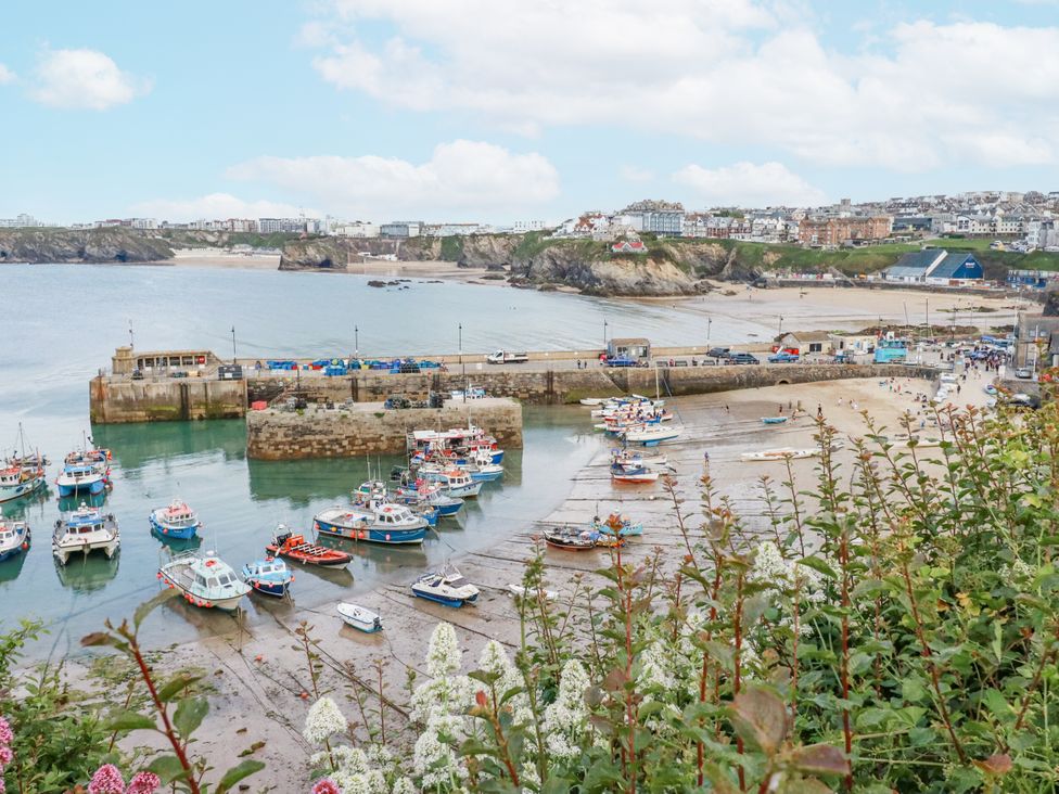 A harbor with boats and a beach at Beach View House in Newquay
