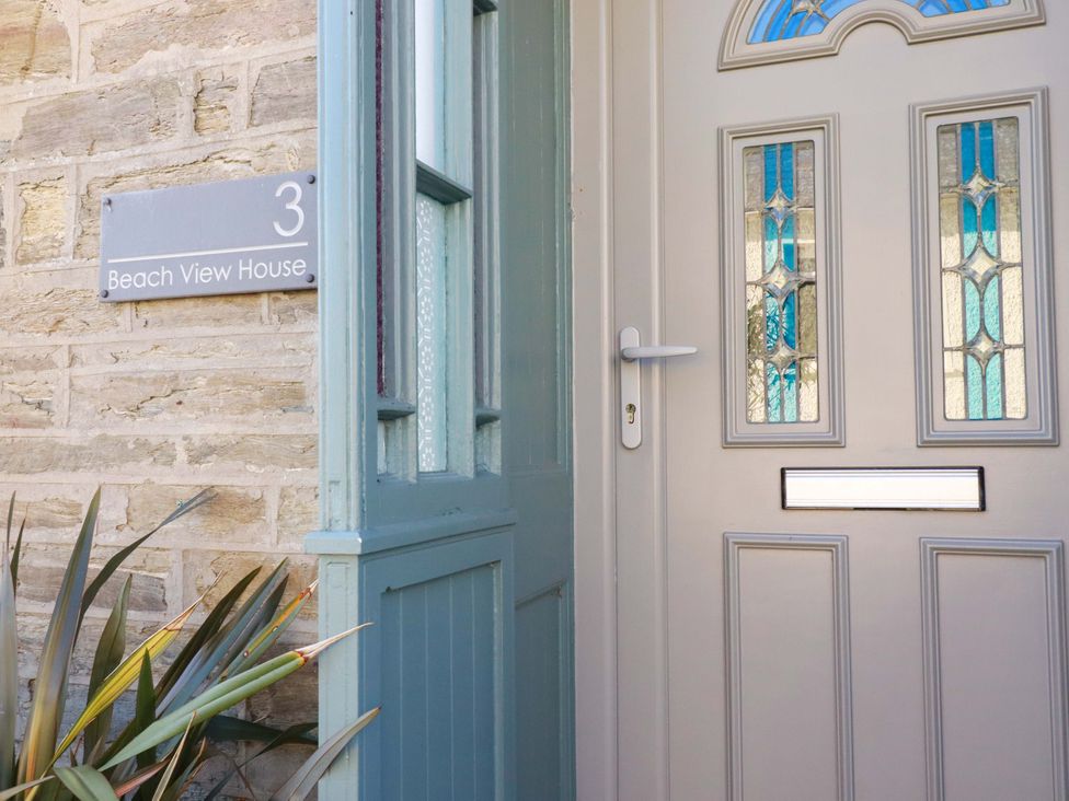 An entrance door with a nameplate at Beach View House in Newquay