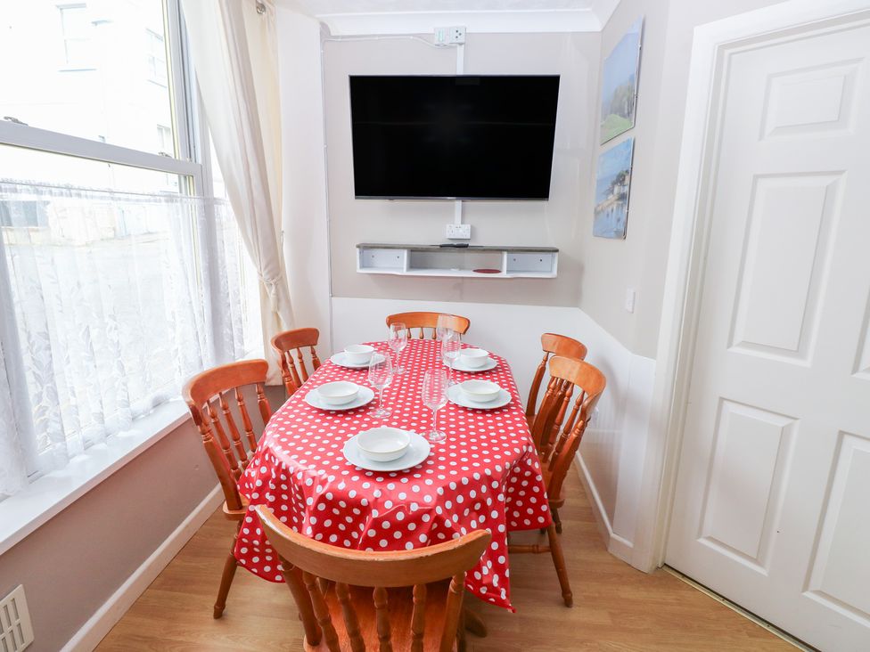 A dining room with a table and chairs at The Hilton Retreat in Tenby