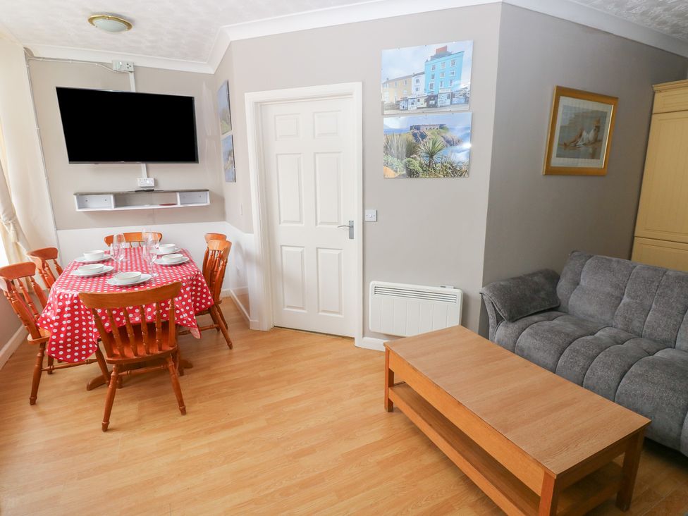 A dining room with a table and chairs at The Hilton Retreat in Tenby