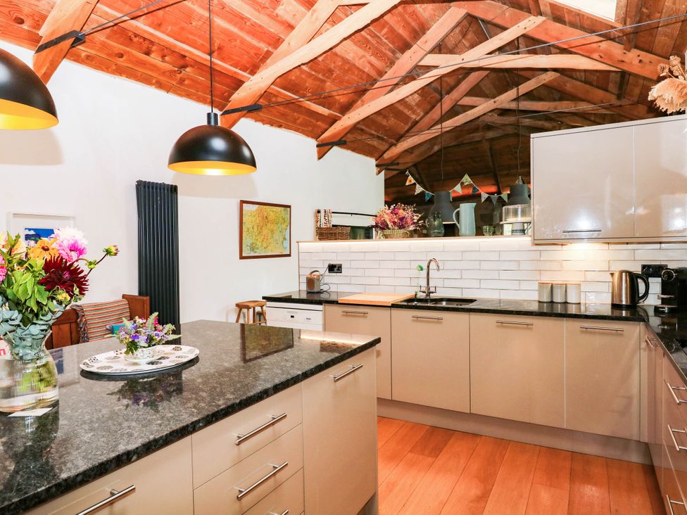A kitchen with a sink and appliances at Halshanger Barn Newton Abbot