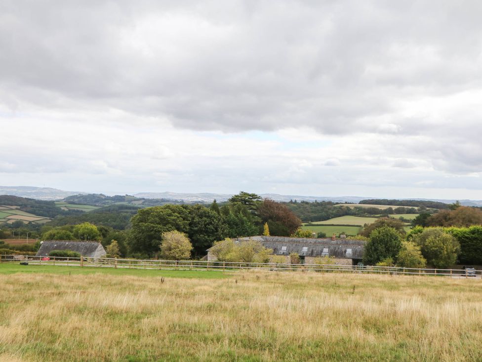 A view of fields and farmhouses at Halshanger Barn in Newton Abbot