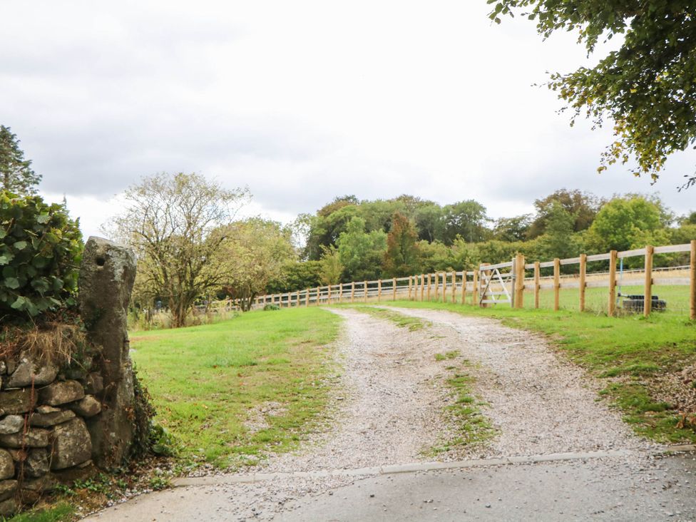 A gravel path leading through greenery at Halshanger Barn in Newton Abbot