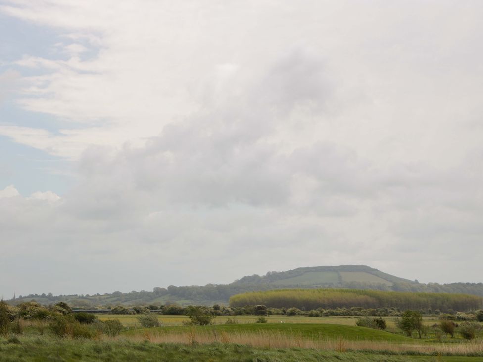 A landscape with hills and clouds at Flat 24 in Brean