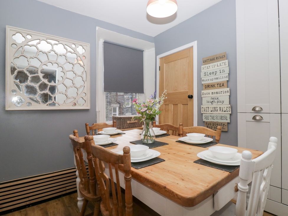A dining room with a table and chairs at The Wonky Nest in Bowness-On-Windermere