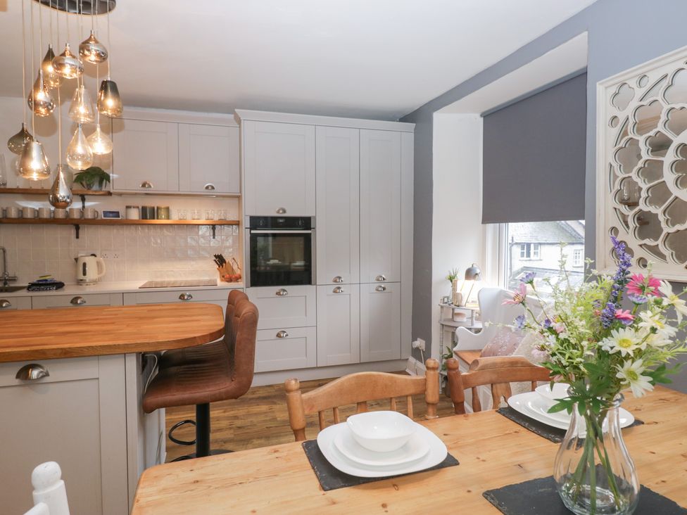 A kitchen with table and chairs at The Wonky Nest in Bowness-On-Windermere