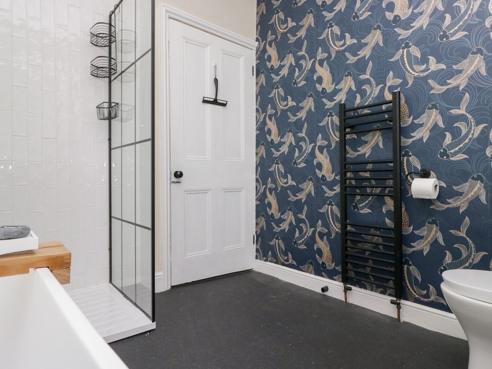 A bathroom with a shower and toilet at The Wonky Nest in Bowness-On-Windermere