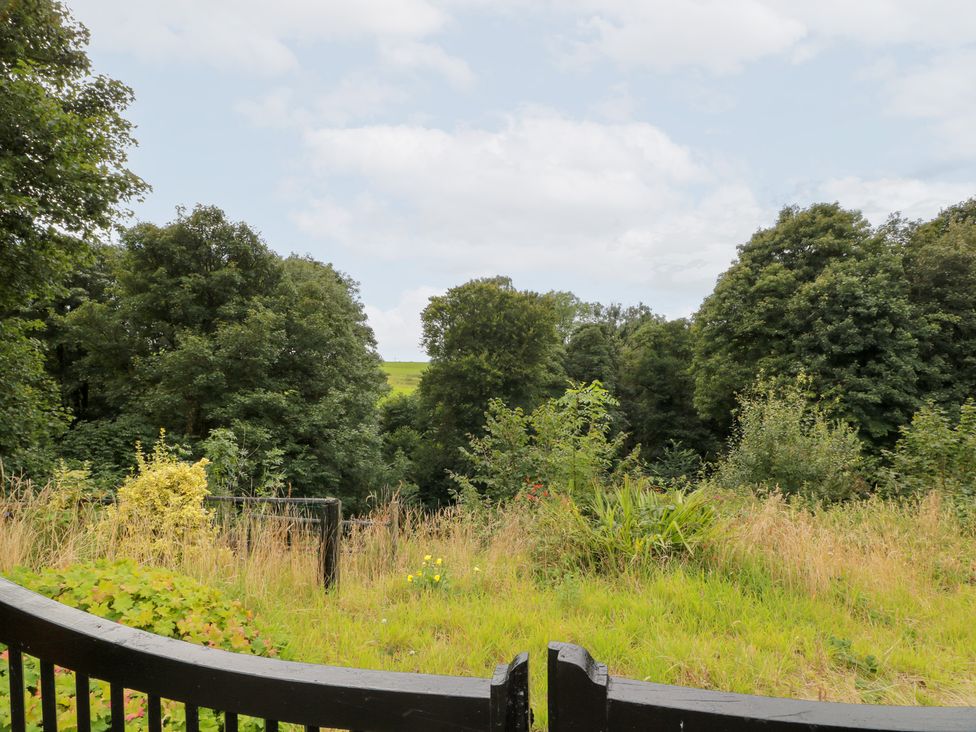A view of trees and grass in a garden at Balsaggart Farm 