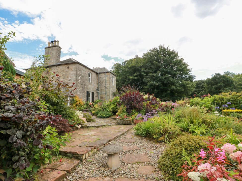 A house with a garden and pathway at Balsaggart Farm