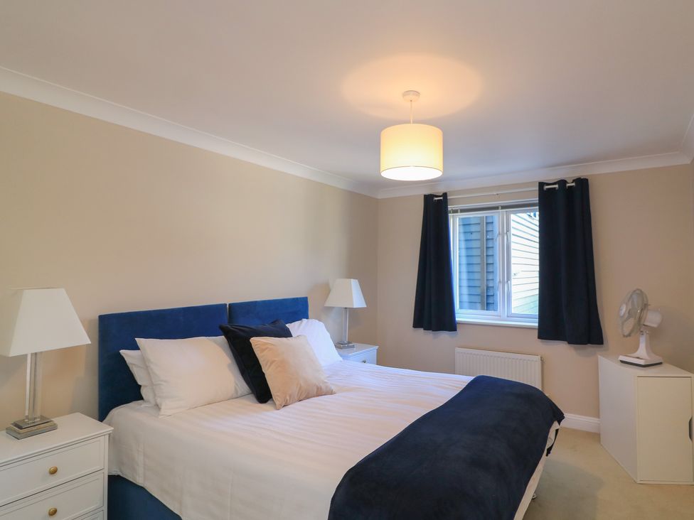 A bedroom with a bed and a window at 6 Dartmouth House in Dartmouth